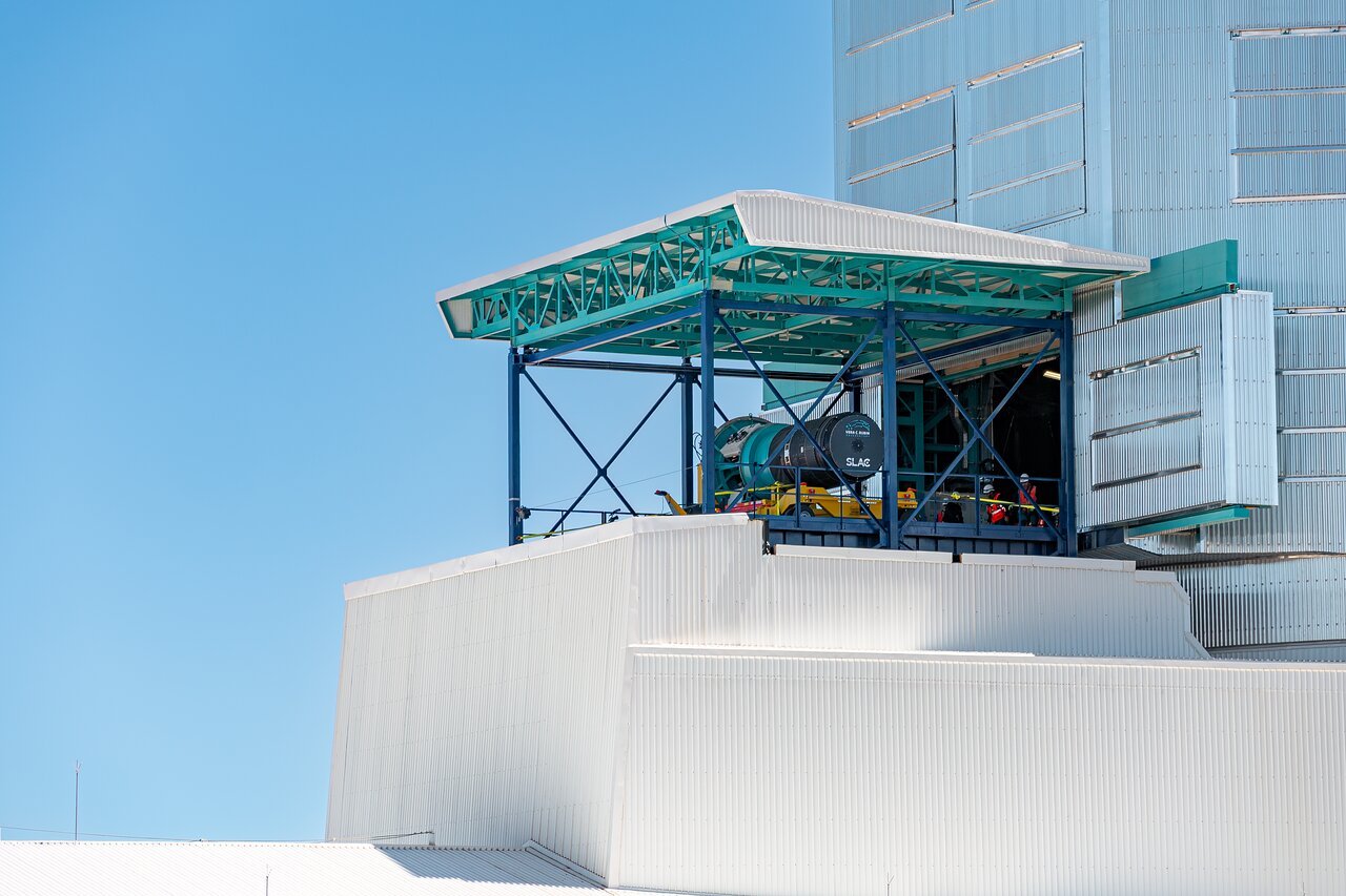 LSST Camera Installation <p>External view of the <a href="https://rubinobservatory.org/explore/how-rubin-works/technology/camera">LSST Camera</a> on the vertical lift platform during its installation on the <a href="https://noirlab.edu/public/programs/vera-c-rubin-observatory/simonyi-survey-telescope/">Simonyi Survey Telescope</a> at <a href="https://rubinobservatory.org/">NSF–DOE Vera C. Rubin Observatory</a> in March 2025.</p>